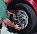 wheel skin or wheelskin wheel cover being installed on a Ford pickup truck wheel.