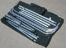 softopper pickup truck bed topper cover shown
                  unassembled.